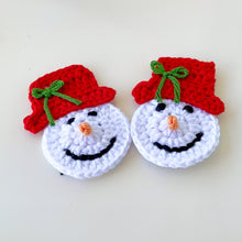 Handmade crochet snowman ornaments with red hats, cute Christmas decor, winter holiday decorations, DIY snowman amigurumi pattern.
