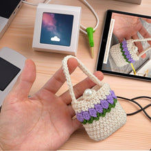 Handmade crochet mini bag with handle, cream and purple design, boho-style accessory, small crochet purse, DIY gift idea for women.