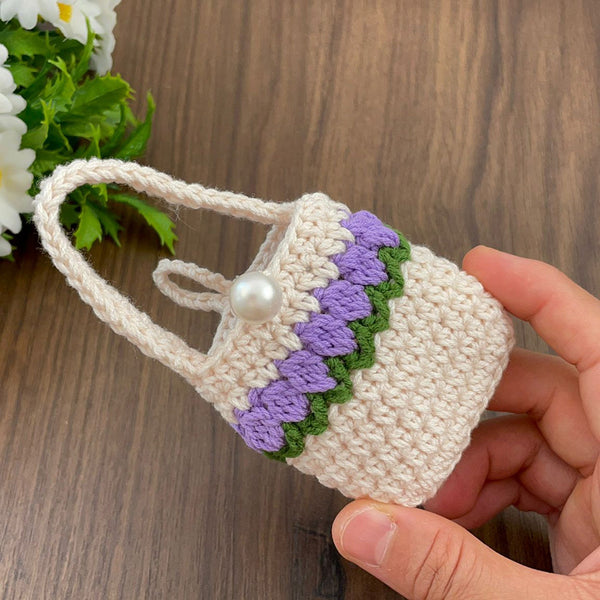 Handmade crochet mini bag with handle, cream and purple design, boho-style accessory, small crochet purse, DIY gift idea for women.