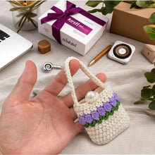 Handmade crochet mini bag with handle, cream and purple design, boho-style accessory, small crochet purse, DIY gift idea for women.