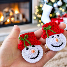 Handmade crochet snowman ornaments with red hats, cute Christmas decor, winter holiday decorations, DIY snowman amigurumi pattern.