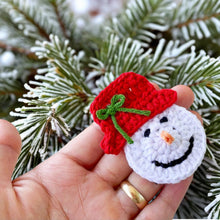 Handmade crochet snowman ornaments with red hats, cute Christmas decor, winter holiday decorations, DIY snowman amigurumi pattern.