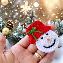 Handmade crochet snowman ornaments with red hats, cute Christmas decor, winter holiday decorations, DIY snowman amigurumi pattern.