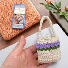 Handmade crochet mini bag with handle, cream and purple design, boho-style accessory, small crochet purse, DIY gift idea for women.