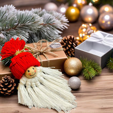Handmade macrame gnome ornament with a red hat, boho Christmas decor, cute Scandinavian-inspired holiday decoration, DIY gift idea.