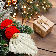Handmade macrame gnome ornament with a red hat, boho Christmas decor, cute Scandinavian-inspired holiday decoration, DIY gift idea.