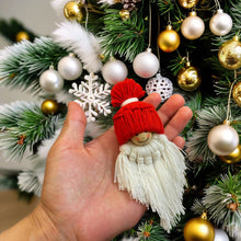 Handmade macrame gnome ornament with a red hat, boho Christmas decor, cute Scandinavian-inspired holiday decoration, DIY gift idea.