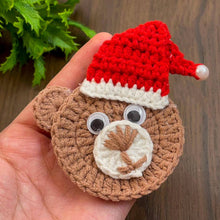 Handmade crochet bear ornament with a Santa hat, cute Christmas decoration, festive amigurumi gift idea, cozy holiday decor for tree or home.