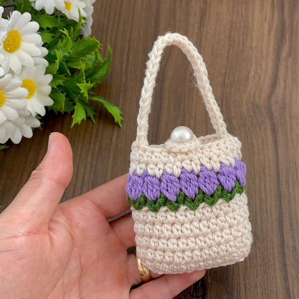Handmade crochet mini bag with handle, cream and purple design, boho-style accessory, small crochet purse, DIY gift idea for women.