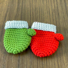 Handmade red crochet mini Christmas mitten, perfect for holiday decoration, Christmas tree ornament, gift tag, and home decor.