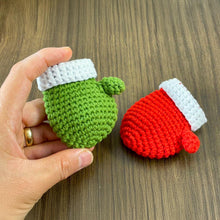 Handmade red crochet mini Christmas mitten, perfect for holiday decoration, Christmas tree ornament, gift tag, and home decor.