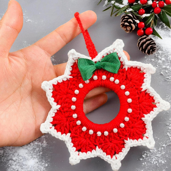 Handmade red and white crochet Christmas ornament, pearl-accented wreath decoration for wall or tree