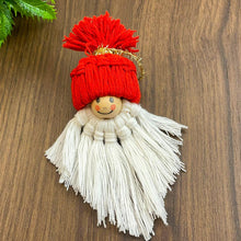 Handmade macrame gnome ornament with a red hat, boho Christmas decor, cute Scandinavian-inspired holiday decoration, DIY gift idea.
