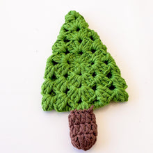 A handmade crochet pine tree keychain with a vibrant green top and a textured brown trunk, designed as a cute and eco-friendly accessory. Perfect for use as a keychain, bag charm, or small Christmas tree ornament.