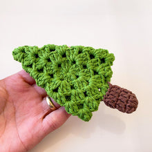 A handmade crochet pine tree keychain with a vibrant green top and a textured brown trunk, designed as a cute and eco-friendly accessory. Perfect for use as a keychain, bag charm, or small Christmas tree ornament.