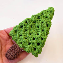 A handmade crochet pine tree keychain with a vibrant green top and a textured brown trunk, designed as a cute and eco-friendly accessory. Perfect for use as a keychain, bag charm, or small Christmas tree ornament.