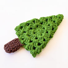 A handmade crochet pine tree keychain with a vibrant green top and a textured brown trunk, designed as a cute and eco-friendly accessory. Perfect for use as a keychain, bag charm, or small Christmas tree ornament.