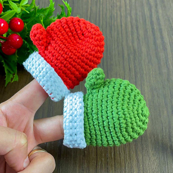 Handmade red crochet mini Christmas mitten, perfect for holiday decoration, Christmas tree ornament, gift tag, and home decor.