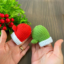 Handmade red crochet mini Christmas mitten, perfect for holiday decoration, Christmas tree ornament, gift tag, and home decor.