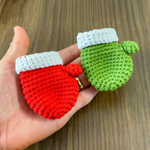 Handmade red crochet mini Christmas mitten, perfect for holiday decoration, Christmas tree ornament, gift tag, and home decor.