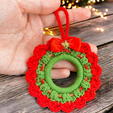Handmade crochet Christmas wreath ornament with red and green design and decorative bow