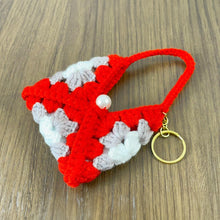 Handmade crochet granny square keychain pouch in vibrant red, gray, and white, featuring a pearl detail—perfect for carrying small items in style. ✨🔑