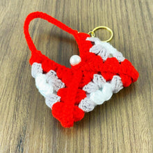 Handmade crochet granny square keychain pouch in vibrant red, gray, and white, featuring a pearl detail—perfect for carrying small items in style. ✨🔑