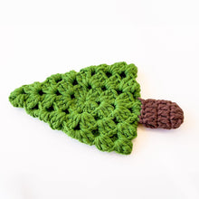 A handmade crochet pine tree keychain with a vibrant green top and a textured brown trunk, designed as a cute and eco-friendly accessory. Perfect for use as a keychain, bag charm, or small Christmas tree ornament.