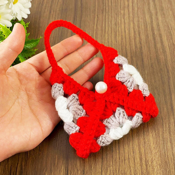 Handmade crochet granny square keychain pouch in vibrant red, gray, and white, featuring a pearl detail—perfect for carrying small items in style. ✨🔑