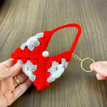 Handmade crochet granny square keychain pouch in vibrant red, gray, and white, featuring a pearl detail—perfect for carrying small items in style. ✨🔑